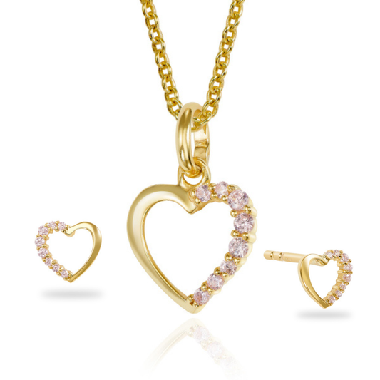 Gold heart-shaped jewelry set with pink gemstones on a white background