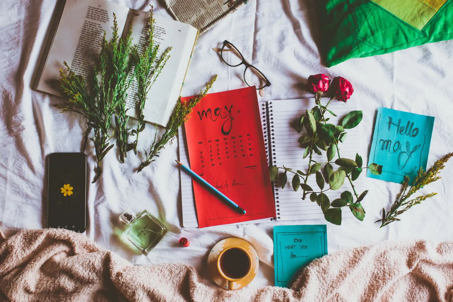 A flat lay of various items associated with relaxation and planning.