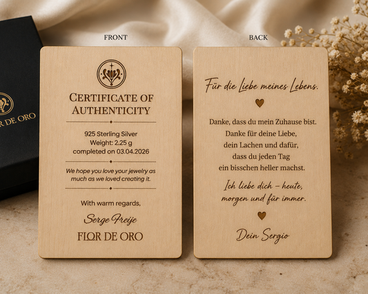 Wooden certificate of authenticity for jewelry with text and branding on a beige background.